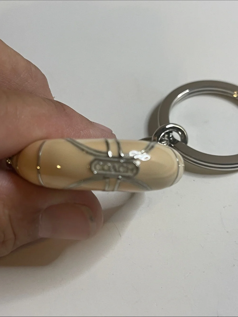 Coach Beige Enamel Handbag Keychain and Coach Pen